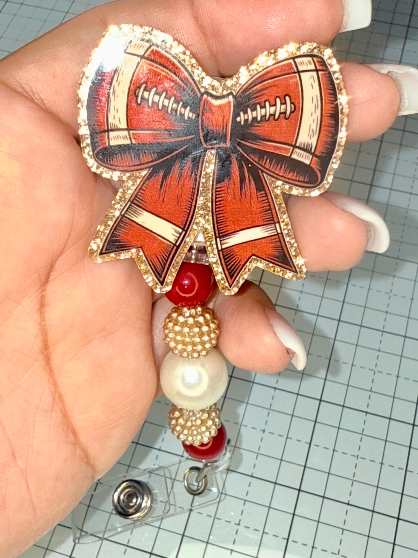 Football Bow Badge Reel